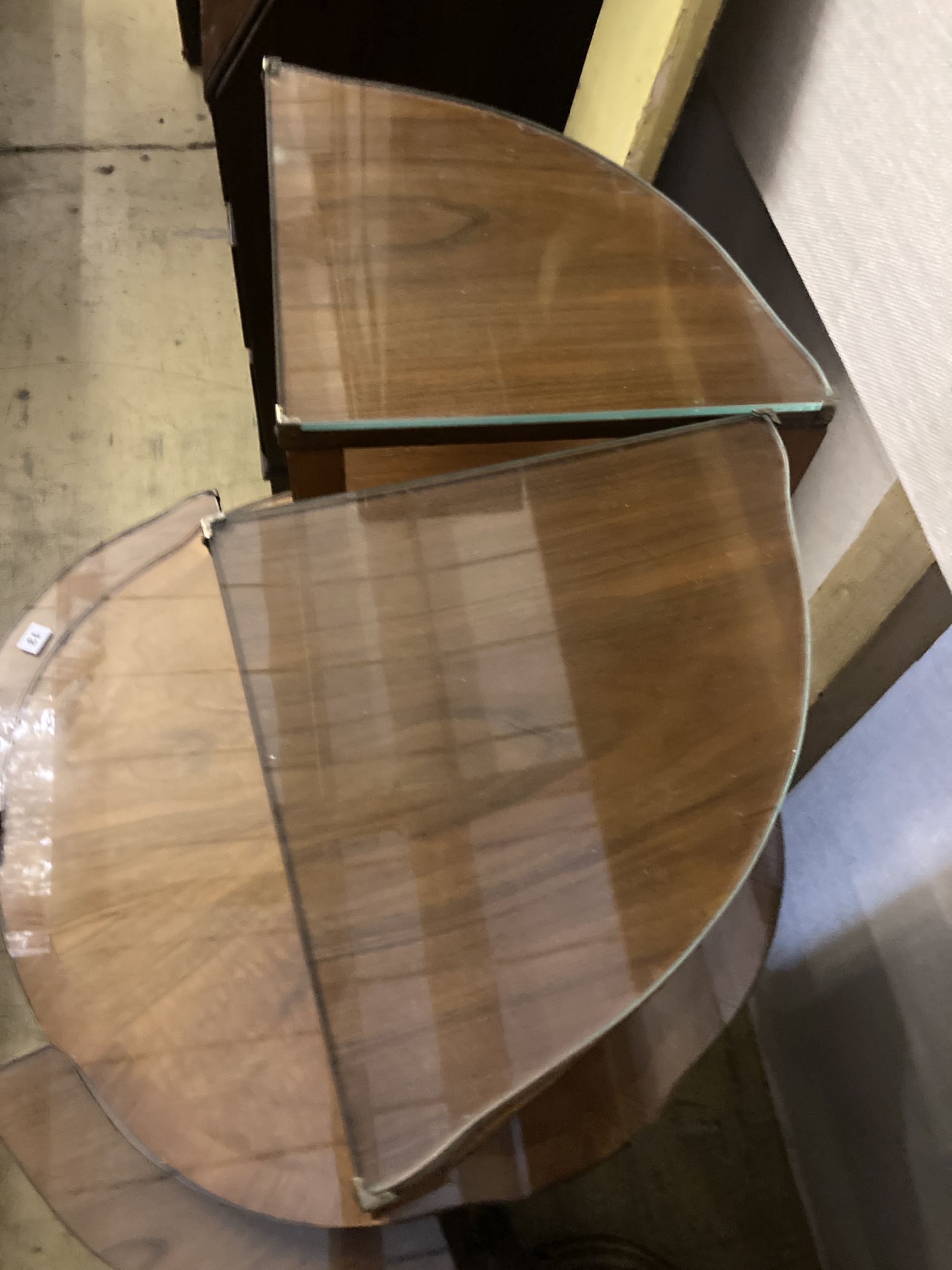 An Art Deco figured walnut nest of tables, n the manner of Epstein, diameter 74cm height 55cm